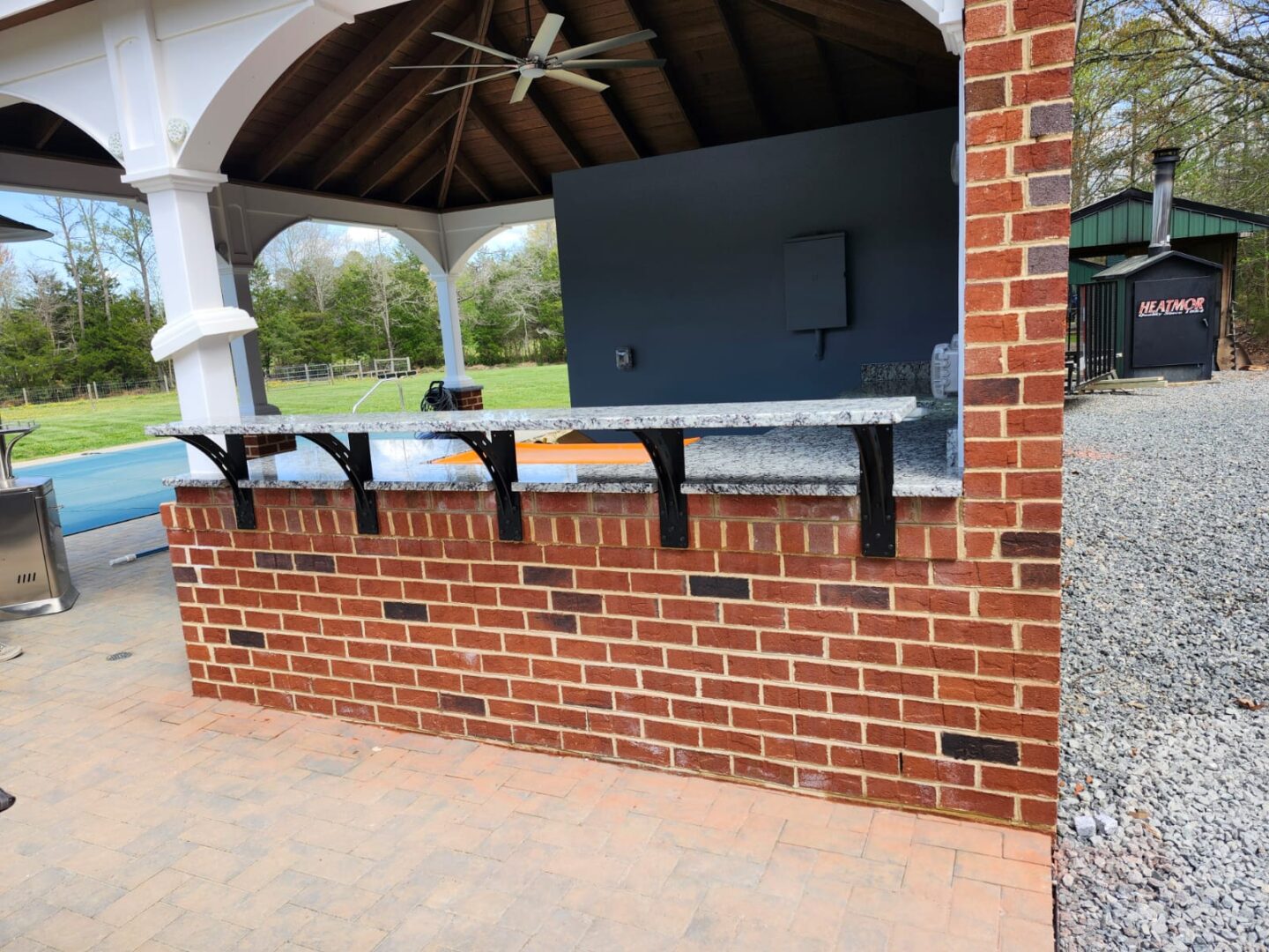 Outdoor granite kitchen countertop installation in Virginia Beach VA by 3 J’s Granite & Marble Services.